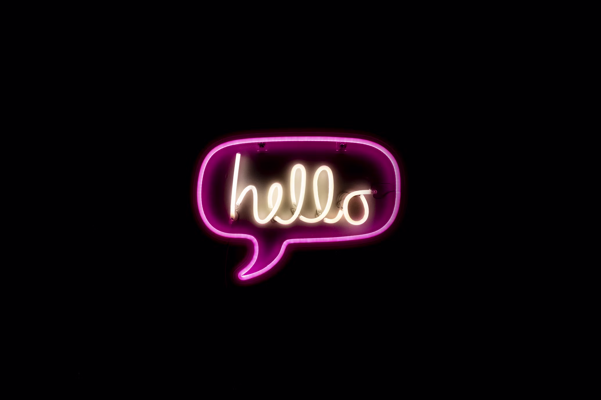 Neon sign in a dark interior, fully purple tinted